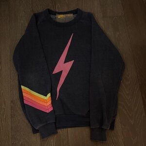 Aviator Nation Dark Grey Sweater with Rainbow Strips and Pink Lightning Bult